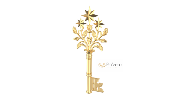 Ein goldener Schlüssel mit floralen Verzierungen und einem dekorativen Kopf.
